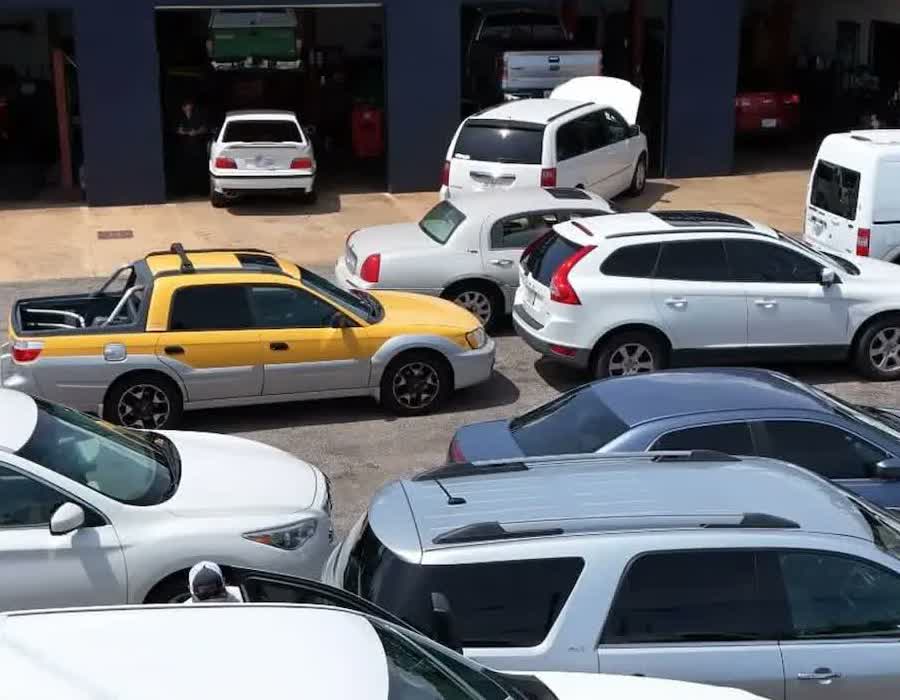 The open service bays at Bobby Tyson's with vehicles on lifts inside