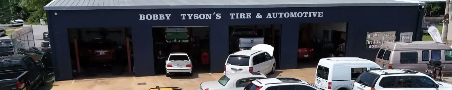 The painted Bobby Tyson's Tire & Automotive lettering across the shop building